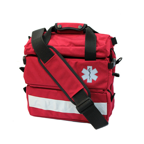 Red emergency medical bag with reflective strip, medical symbol, and multiple compartments for portable first aid use.
