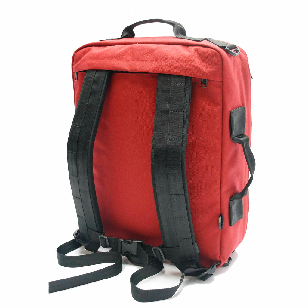Red emergency medical backpack with reflective strip and Star of Life symbol, designed for first responders and outdoor use.
