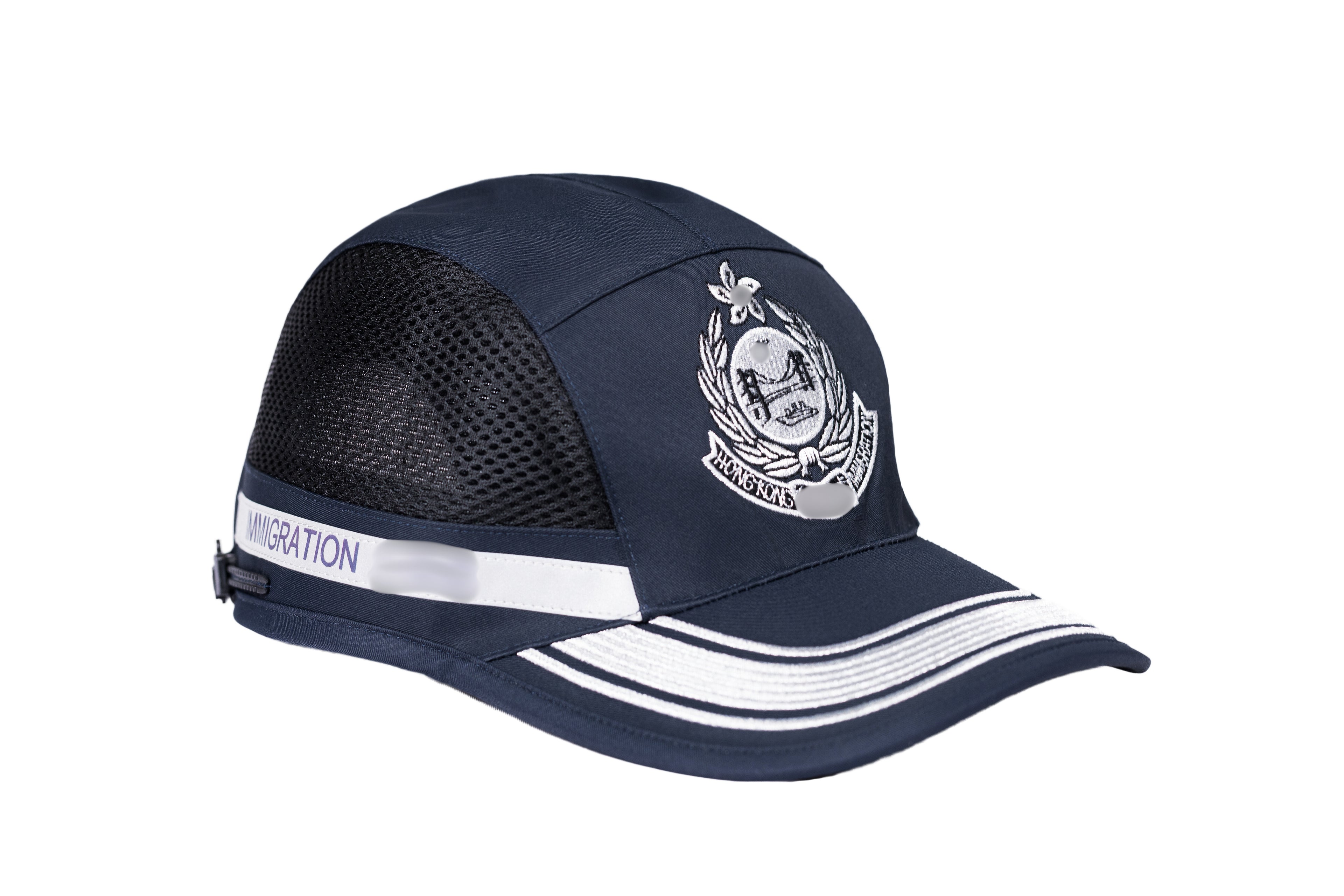 Dark blue Hong Kong Immigration Department officer cap with embroidered emblem featuring a shield, handshake, sunburst, laurel wreath, and star. Includes mesh ventilation panels and a white strip labeled "IMMIGRATION" on the side.